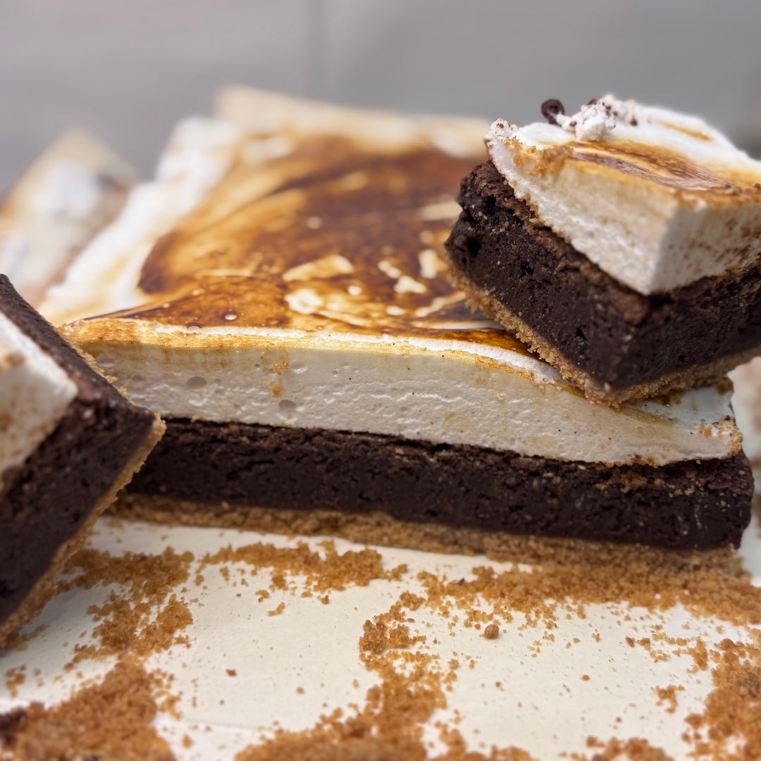 Close-up of a layered dessert with graham, brownie and toasted homemade marshmallow