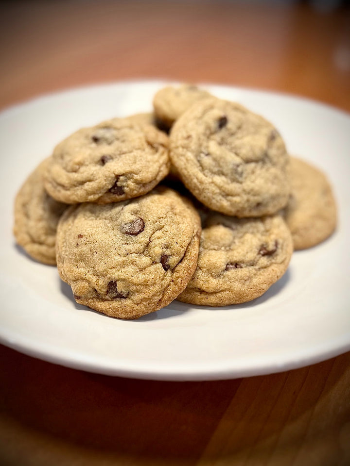 A plate of freshly baked Ghirardelli Chocolate Chip cookies made by Turtle Tracks.
