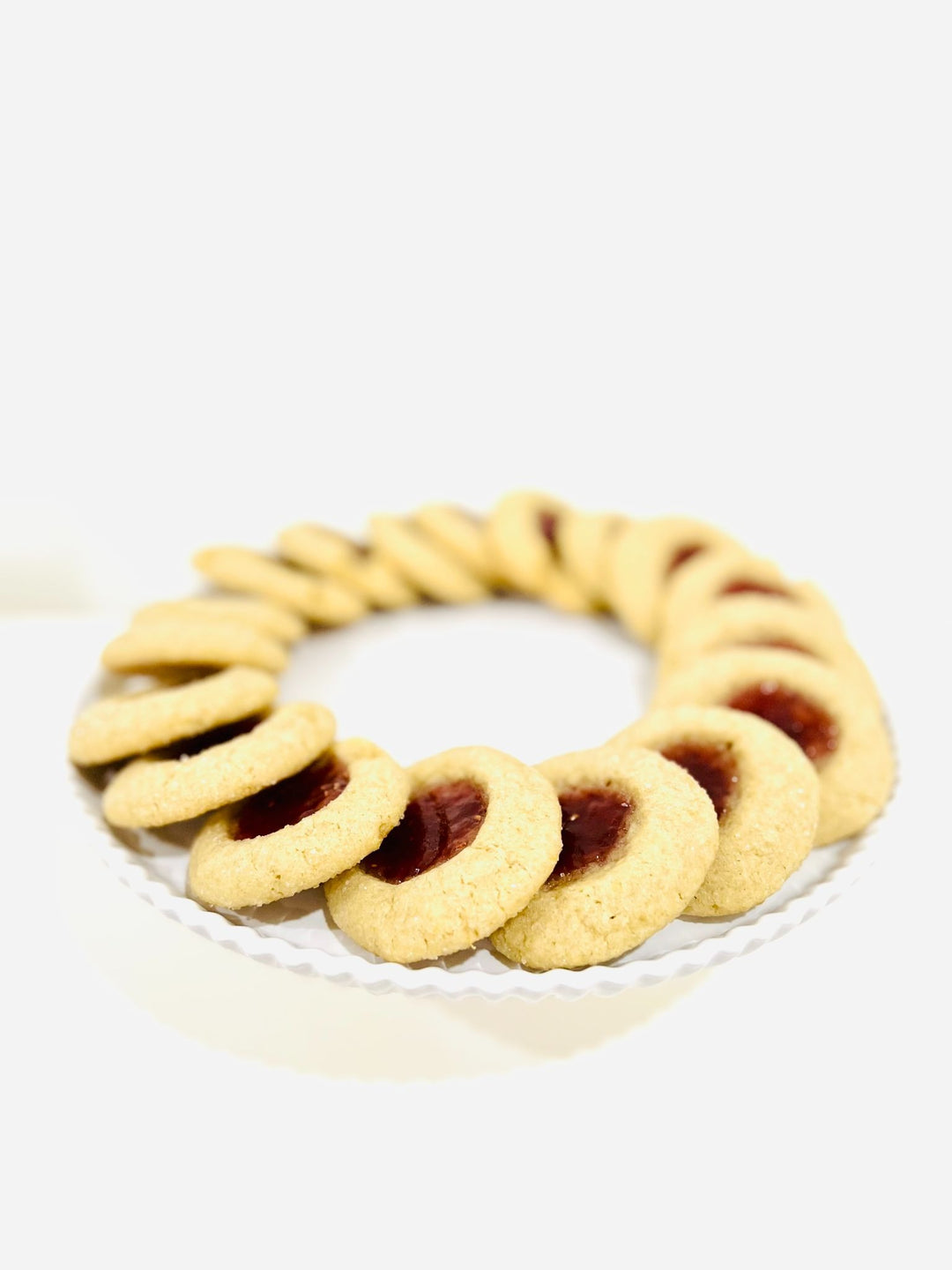 A plate of delicious looking Lemon Raspberry Thumbprint cookies by Turtle Tracks.